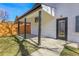 Covered patio in backyard has new white paint and black trim and accents at 1317 Monroe St, Denver, CO 80206