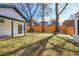 Spacious backyard featuring a well-maintained lawn and a stylish modern fence at 1317 Monroe St, Denver, CO 80206