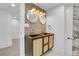 Bathroom featuring dual sinks, decorative tile, and modern lighting fixtures at 1317 Monroe St, Denver, CO 80206