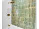 Shower featuring decorative tile, modern fixtures, and tub at 1317 Monroe St, Denver, CO 80206