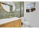 Bathroom featuring stylish sink with wood vanity and modern fixtures at 1317 Monroe St, Denver, CO 80206