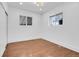 Bright bedroom with hardwood floors and two windows at 1317 Monroe St, Denver, CO 80206