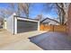 The driveway leads to a spacious two-car garage and includes a modern wooden privacy fence at 1317 Monroe St, Denver, CO 80206