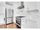 Modern kitchen with stainless steel appliances and bright white cabinetry at 1317 Monroe St, Denver, CO 80206