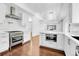 A contemporary open-plan kitchen with stone countertops, stainless steel appliances and lighting at 1317 Monroe St, Denver, CO 80206