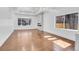 Bright living room with wood floors, modern lighting and a beautiful fireplace feature at 1317 Monroe St, Denver, CO 80206