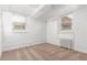 A simply decorated bedroom with carpeted floor, two windows and a radiator at 4685 Wadsworth Blvd, Wheat Ridge, CO 80033