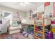 Bedroom features fun colorful decor, bunk beds, and built-in storage at 4685 Wadsworth Blvd, Wheat Ridge, CO 80033