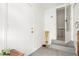 Entry hall featuring neutral walls, doorways, and tile flooring, blending functionality with simple design at 4685 Wadsworth Blvd, Wheat Ridge, CO 80033