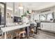 Bright, well-lit kitchen area also used as home office with desk, chair, and modern appliances at 4685 Wadsworth Blvd, Wheat Ridge, CO 80033