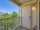 View from balcony showing outdoor space and wooded area beyond at 5705 N Genoa Way # 308, Aurora, CO 80019