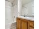 Bathroom featuring tub with shower and single vanity at 5705 N Genoa Way # 308, Aurora, CO 80019