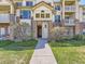 Exterior view of the front entrance of the condo complex at 5705 N Genoa Way # 308, Aurora, CO 80019