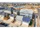 Aerial view of the home and neighborhood showing solar panels on roofs at 5074 Yosemite Ct # 1, Denver, CO 80238