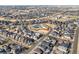 An aerial view of a neighborhood with a community pool and homes with solar panels at 5074 Yosemite Ct # 1, Denver, CO 80238