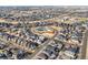 An aerial view of a neighborhood with a community pool and homes with solar panels at 5074 Yosemite Ct # 1, Denver, CO 80238
