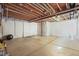 Unfinished basement with concrete floor and exposed ceiling, ready for customization and storage space at 5074 Yosemite Ct # 1, Denver, CO 80238