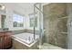 A bathroom showcases a separate shower and soaking tub with decorative tile accents at 5074 Yosemite Ct # 1, Denver, CO 80238