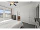 Bright bedroom with neutral walls, a large window, and en suite bathroom entrance at 5074 Yosemite Ct # 1, Denver, CO 80238