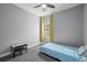 Cozy bedroom with light grey walls, comfortable carpet, and a built-in ceiling fan at 5074 Yosemite Ct # 1, Denver, CO 80238