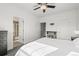 A neutral bedroom with a fireplace and bathroom access adds warmth and charm at 5074 Yosemite Ct # 1, Denver, CO 80238