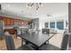 An open-concept dining area with modern lighting fixtures connects the kitchen and living space at 5074 Yosemite Ct # 1, Denver, CO 80238