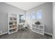 A functional home office has natural light, and ample storage on shelves and cabinets at 5074 Yosemite Ct # 1, Denver, CO 80238