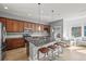 Kitchen boasts a large island with pendant lighting, ample counter space, and seating for three at 5074 Yosemite Ct # 1, Denver, CO 80238