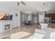 Bright, open living area featuring a fireplace, dining area, and kitchen with bar stool seating for casual dining at 5074 Yosemite Ct # 1, Denver, CO 80238