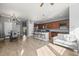 Open-concept living space with a kitchen island, dining area, and comfortable seating, great for entertaining at 5074 Yosemite Ct # 1, Denver, CO 80238
