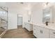 Luxurious bathroom with double vanity, quartz countertops, and a modern marble shower at 30355 E 161St Ave, Brighton, CO 80603