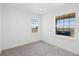 Sun-filled bedroom with large windows offering exterior views and plush gray carpeting at 30355 E 161St Ave, Brighton, CO 80603