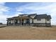 Inviting single-story home with stone accents and a welcoming covered porch; perfect curb appeal at 30355 E 161St Ave, Brighton, CO 80603