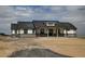 Inviting single-story home with stone accents and a welcoming covered porch; perfect curb appeal at 30355 E 161St Ave, Brighton, CO 80603