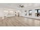 Open-concept living room flowing into the kitchen with plenty of light at 30355 E 161St Ave, Brighton, CO 80603