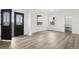 Bright living room with hardwood floors and large windows; modern design at 30355 E 161St Ave, Brighton, CO 80603