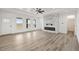 Bright and open living room with large windows and a modern fireplace at 30355 E 161St Ave, Brighton, CO 80603