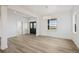 Inviting living room with hardwood floors, contemporary lighting, and a sleek entryway at 30355 E 161St Ave, Brighton, CO 80603