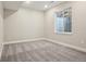 Neutral basement space with carpet and window to the outside well at 5930 S Platte Canyon Dr, Littleton, CO 80123