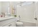 Clean bathroom featuring white subway tile, modern fixtures, and a combination tub and shower at 5930 S Platte Canyon Dr, Littleton, CO 80123