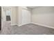 Cozy carpeted bedroom features sliding closet doors for ample storage space at 5930 S Platte Canyon Dr, Littleton, CO 80123