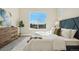 Comfortable bedroom with plush carpet, neutral walls, and a large window with scenic views at 5930 S Platte Canyon Dr, Littleton, CO 80123