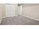 Bedroom featuring neutral carpeting, a double-door closet, and passage to another room at 5930 S Platte Canyon Dr, Littleton, CO 80123