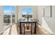 Dining room with large window, great view, table set for six, and hardwood floors at 5930 S Platte Canyon Dr, Littleton, CO 80123