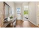 Inviting entryway featuring hardwood floors and a view to the bedroom at 5930 S Platte Canyon Dr, Littleton, CO 80123