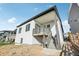 The exterior of the home, featuring a covered back deck and well-maintained landscaping at 5930 S Platte Canyon Dr, Littleton, CO 80123