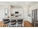 Modern kitchen with stainless steel appliances, island bar and stylish pendant lighting at 5930 S Platte Canyon Dr, Littleton, CO 80123