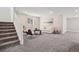 Finished living area offers neutral paint, carpet, and recessed lighting at 5930 S Platte Canyon Dr, Littleton, CO 80123