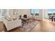 Spacious living room with fireplace, area rug, large windows and hardwood flooring at 5930 S Platte Canyon Dr, Littleton, CO 80123