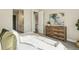 Well-lit bedroom with stylish furnishings, décor, and view to ensuite bathroom at 5930 S Platte Canyon Dr, Littleton, CO 80123